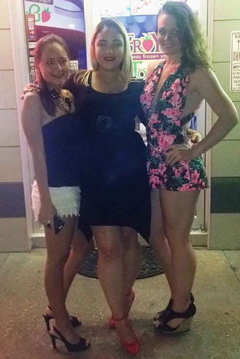 Victoria, far right in the floral dress